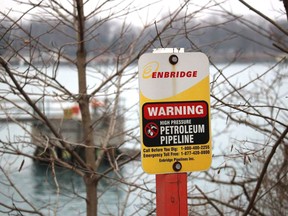A sign marks where an Enbridge pipeline crosses the St. Clair River between Michigan and Ontario near Sarnia. File photo/Postmedia Network