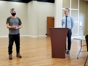 Bezushko, left, receives his Matthew Claus Award from Stony Plain Town Manager Tom Goulden, right at a recent COVID-19 safe meeting. The Town of Stony Plain created the award in memory of a former employee who died in 2016 and has given it out annually since then.