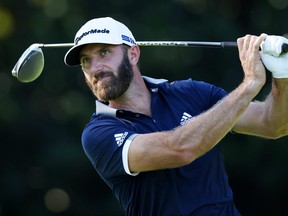 Dustin Johnson plays his shot from the ninth tee during the second round of the Masters at Augusta National Golf Club on Thursday