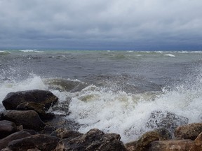 The waves crash into the rocks near Sauble Beach over the noon hour on Sunday.