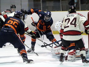 PETER RUICCI/Sault Star

Blind River's Justin Mauro, a Sault native, looks for a rebound in front of Soo Thunderbirds goaltender Scott Young, as defencemen Cam Dutkiewicz (left) and Dylan Parsons help cover up in NOJHL exhibition action at John Rhodes Community Centre