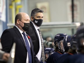 PETER RUICCI/Sault Star

Soo Thunderbirds head coach Denny Lambert (left) is joined by assistant Gary Roach behind the bench during NOJHL action at John Rhodes Community Centre