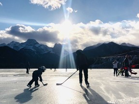 Canmore RCMP warned drivers that it is illegal to park along the side of the provincial highway at Gap Lake, after hundreds flocked to the frozen lake for ice skating on the weekend. The traffic resulted in a multi-vehicle collision along the 1A Highway on Nov. 28. Photo Marie Conboy/ Postmedia.