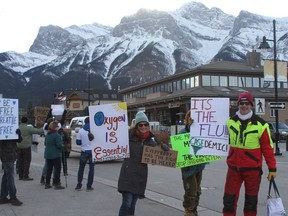A protest against mandated masks and other public health measures intended to prevent the spread of COVID-19 took place in Canmore on Nov. 29. Some signs at expressed misinformation saying masks cause bacterial or fungal infections. Photo Marie Conboy/ Postmedia.