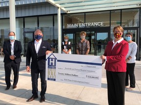 Brockville General Hospital accepts a $20 million cheque from the Brockville and District Hospital Foundation. This cheque covers the community portion towards BGH’s Donald B. Green Tower, which opened to patients on October 24. (Photo courtesy of BGH.)