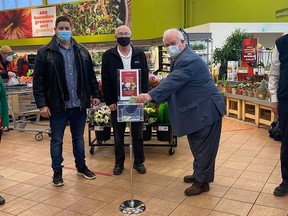Quinte West Mayor Jim Harrison makes a donation to the Christmas Hamper program being run by At the Crossroads Church, earlier this week at Smylie's Independent Grocer in Trenton, Also pictured, from the left are: Chelsey Collar, Travis Blais, Allen Robinson and John Smylie.
SUBMITTED PHOTO