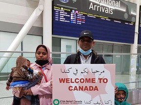 Rohingya refugees Anuwar Yosof, his wife, Bilkis Husen, and their two young children, arrive at Pearson Airport on Nov. 18. Facing persecution in their home country of Myanmar, they are settling in Brantford with the help of sponsoring group CARES in Brant.