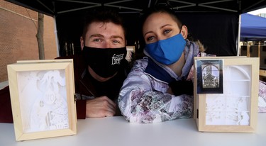 Emma Reaume, right, of Hand Crafted Shadow Boxes in Chatham, Ont., sells her wares with Nick Swan at the annual All I Want For Christmas Expo at Downtown Chatham Centre in Chatham, Ont., on Saturday, Nov. 7, 2020. Mark Malone/Chatham Daily News/Postmedia Network