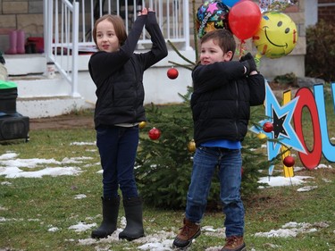 Connor and his older sister Isla doing some warmup exercises. Photo on Saturday, November 28, 2020, in Cornwall, Ont. Todd Hambleton/Cornwall Standard-Freeholder/Postmedia Network