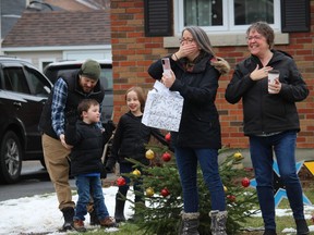 From left on the front lawn during the drive-by party/parade are Wilson family members Ryan, with son Connor and daughter Isla, mom Krista and Connor's grandmother, Kim Payette. Photo on Saturday, November 28, 2020, in Cornwall, Ont. Todd Hambleton/Cornwall Standard-Freeholder/Postmedia Network