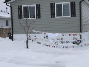 A set up of masks for the taking at a home on Jubilee Loop near Jubilee Drive in Sherwood Park. Travis Dosser/News Staff