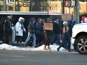 A group of protesters against mask mandates, lockdowns and the great reset make their way along 109 Ave. in downtown Edmonton, November 21, 2020. Ed Kaiser/Postmedia