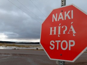 A stop sign in Fort Chipewyan in Cree (top), Dene and English. Supplied Image/Regional Municipality of Wood Buffalo