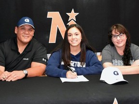 Port Elgin's Francesca Alpajaro (centre) poses with her parents Peter and Joanna while she unveils her commitment to play for the Georgetown Hoyas Women's Lacrosse team in 2021. Photo submitted.