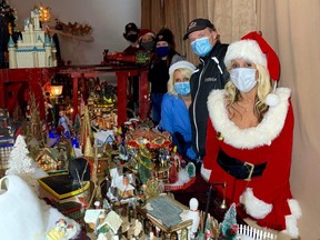 Ida Mcaulay (in foreground) with help from family and friends, has created a large Christmas village display at 31 West Street in Goderich. The display aims to bring joy and a moment of peace for visitors to the shop front leading up to Christmas. Kathleen Smith