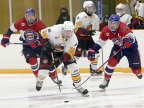 Timmins Rock defenceman Brendan Boyce (29) handles the puck while Rayside-Balfour Canadians forward Brady Maltais (14) gives chase during first-period NOJHL action at Chelmsford Arena in Chelmsford, Ontario on Sunday, November 15, 2020.