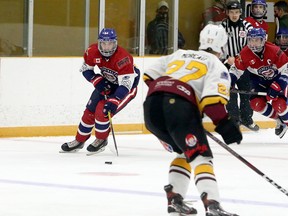 Rayside-Balfour Canadians forward Nick DeGrazia (61) carries the puck during NOJHL action against the Timmins Rock at Chelmsford Arena in Chelmsford, Ontario on Thursday, November 19, 2020.