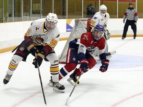 Timmins Rock defenceman Brendan Boyce (29) handles the puck while Rayside-Balfour Canadians forward Nick DeGrazia (61) pursues during NOJHL action at Chelmsford Arena in Chelmsford, Ontario on Thursday, November 19, 2020.