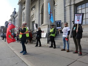 More than 40 people demonstrated outside Kingston City Hall during a "Freedom March" event on Sunday. Individuals assembled to protest government response to COVID-19.