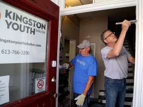 Employees of the Kingston Novelis plant, including John Shetler, left, and Bob Bertrand, donated their work hours sprucing up the Kingston Youth Shelter on Brock Street on Oct. 15, 2019. This year they are working at the Kingston Youth Shelter transitional home on Yonge Street. The plant has released employees for the past few years to work on projects benefiting agency members of the United Way of Kingston, Frontenac, Lennox and Addington. (Ian MacAlpine/The Whig-Standard)