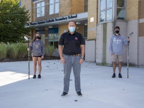 Madison Chantler, a player on the STA girls hockey team, Chad Palmer, coach of the STA boys hockey team and Dylan Dundas, a player on the STA boys hockey team in London, Ont. on Tuesday September 22, 2020. Derek Ruttan/The London Free Press/Postmedia Network