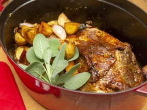 Roast pork with potatoes, shallots and cider. (Mike Hensen/The London Free Press)