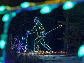 A cross country skier is framed by other lights. The Northern Spirit Light Show's annual display is a Christmas tradition for many in the South Peace and this year's show begins Thursday, Nov. 19 at Evergreen Park.  This is one of the few events that has not been moved  online as patrons will remain safe with those they travelled with in their vehicles while touring the show.