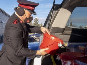 Capt. Peter Kim of the Grande Prairie Salvation Army loads a vehicle on Friday, Nov. 13, 2020.