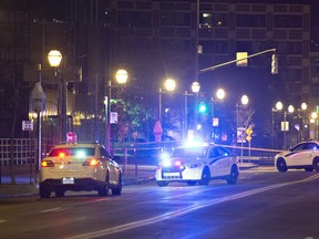 CP-Web. Police cars block the Quai Saint-Andre sweet where they arrested a man in medieval disguise, early Sunday, Nov. 1 in Quebec City. Two people are dead and five people were injured after they were stabbed. THE CANADIAN PRESS/Jacques Boissinot