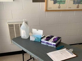 A table with sanitizer, masks, gloves, and a sign-in sheet at South Branch Elementary School in Kemptville is shown here in this photo from August. (Photo credit Upper Canada District School Board)