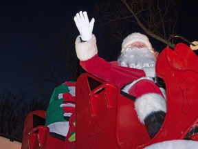 Santa Claus waves to passing vehicles from his sleigh during the annual Parade of Lights in Stratford last year.  CHRIS MONTANINI/STRATFORD BEACON HERALD