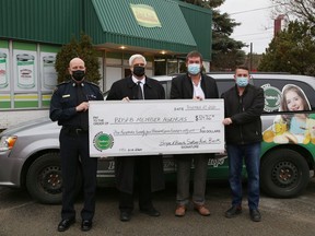 Greater Sudbury Police Chief and Sudbury Food Bank chair Paul Pedersen, left, honorary chair Geoffrey Lougheed, board vice-president J.M. Bray and board director Derik McArthur were on hand at the Sudbury Food Bank in Sudbury, Ont. for an announcement of the food bank's largest fall financial support for it's 40 member agencies on Friday November 27, 2020.