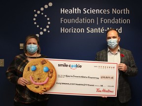 Health Sciences North Foundation has received a record-breaking donation of $50,860 from the local Tim Hortons Smile Cookie campaign, which will support priority needs at HSN. The campaign, which ran the week of Sept. 14, brought the community together to support charities during an unprecedented year. All proceeds from two Tim Hortons located at the main hospital site, as well as a portion from others throughout the city, will go towards supporting quality patient care at HSN. Local Tim Hortons franchises raised a total of $137,459 across Greater Sudbury, with proceeds going to several charities and organizations, including the HSN Foundation. From the left are Erika Theriault, food service director, HSN, Marek Hospitality Inc.; and Anthony Keating, president and CDO of Foundations and Volunteer Groups at HSN. Supplied photo