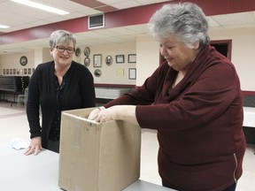 Madeleine Bertrand, office manager at St. Anthony's Church, on left and Lynda Geddes, president of Project Love and now one of the Christmas Food Box committee members, were together at St. Anthony's Church's hall on Wednesday to discuss about the ongoing Christmas Food Box Project. The project which was started by the church members around 30 years ago will be now taken over by Anti-Hunger Coalition and couple other local non-profit organizations. 

RICHA BHOSALE/The Daily Press