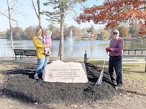 An inscribed rock recognizing the Kinsmen Club of Tillsonburg's 'Lifetime Service Club Recognition Award' was placed adjacent to Lake Lisgar at Concession Street and Park Avenue by the Tillsonburg and District Chamber of Commerce award sponsor E&E McLaughlin Ltd., honouring the club's accomplishments over the past 75 years. In the photo are Kassandra Way from E&E McLaughlin and Tillsonburg Kinsmen Club's Pat Carroll. (Submitted)