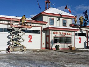 The Millet Fire Department was haard at work Saturday decorating the Millet Fire Hall in preparation for an official "Light it Up for Liam" event Dec. 12 at 6:30 p.m.