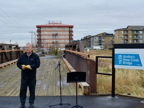 On Oct. 29, Mayor Peter Brown stands on the completed Nose Creek Bridge after its restoration. Photo by Kelsey Yates