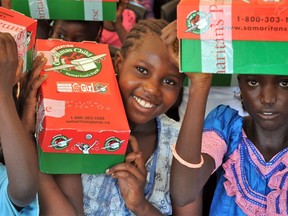 Girls in Senegal with their Canadian-packed Operation Christmas Child shoeboxes. Photo credit Frank King.