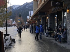 Visitors still flocked to the Bow Valley last weekend. (Pictured) Pedestrians walk down Banff Avenue on Saturday Nov. 21. despite Banff and Lake Louise reporting 108 active cases of COVID-19 on the same day. Photo Marie Conboy/ Postmedia.