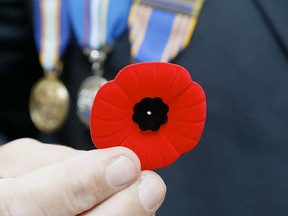 Premier Doug Ford  is taking major new steps to honour veterans ahead of Remembrance Day Nov. 11. He said his government will introduce legislation that permits any employee, regardless of where they work, to wear a poppy.
POSTMEDIA PHOTO