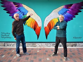 City restaurateur Paul Dinkel and Rick Zimmerman, artistic director of River & Main Theatre Company, showcase the Theatre in The Wings motif on the facade of 30 Bridge St. East, site of the new boutique community theatre that is scheduled to host its first performance in early December. DEREK BALDWIN