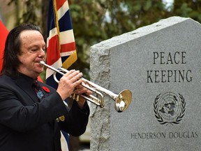 The Last Post, a signature element of the annual Remembrance Day ceremony, was played to a quiet crowd of onlookers. DEREK BALDWIN