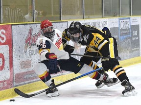 Trenton Golden Hawks' Julien Jacob knocks Wellington Dukes' Ben Woodhouse off the puck during the first game of the inaugural Hasty P's Cup eight-game Summit Series, Wednesday afternoon in Wellington. The game ended with a 2-2 double overtime tie.Game 2 is Friday afternoon in Wellington.
ANDY CORNEAU/OJHL IMAGES