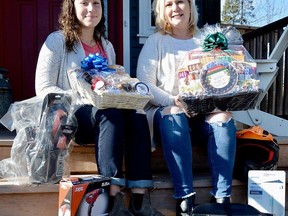 Stirling Rotarian, Laurie Osborne, pictured here with daughter, Zo', along with just a few of the many one-of-a-kind items up for bids throughout the 10-day run of the 2020 Rotary online Christmas auction. The auction goes ÔliveÕ at noon, November 20 and runs until noon, November 30 and features an incredible variety of unique gift items just in time for some early Christmas shopping. Proceeds from the auction stay in the community to support the Stirling Food Bank and the Christmas Baskets program.
TERRY VOLLUM PHOTO
