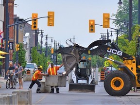 Construction crews placed large concrete blocks this summer to close one lane of Front Street ahead of the highly successful Al Fresco event which drew thousands to city eateries and patios in the downtown. The Belleville Downtown District Business Improvement Area said in its annual report released Tuesday that it recorded a weekly footfall of 7,710 pedestrians in late July as part of the downtown celebrations. DEREK BALDWIN FILE PHOTO