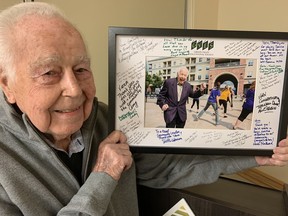 Vern Gale holds a photograph that he received as a gift from the Grand Valley Educational Society on Tuesday.