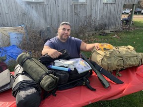 Lance Logan-Keye, of Six Nations of the Grand River, with emergency preparedness packs that he brought to an outdoor learning event on Saturday held by Niwasa Kendaaswin Teg, a non-profit charitable Indigenous organization,  just outside of Ohsweken.