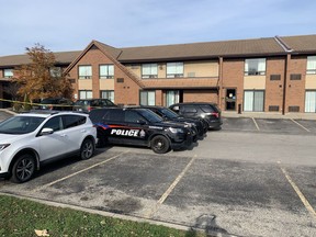Brantford police officers guard the scene of a shooting Saturday morning November 7 at the Comfort Inn at King George Road and Wood Street on Saturday.