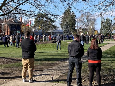 Despite efforts by the City of Brantford to reschedule ceremonies in an attempt to discourage a large gathering, several hundred people stand on the grounds of the Brant County War Memorial in downtown Brantford at 11 a.m. on Remembrance Day, Wednesday November 11, 2020 in Brantford, Ontario. Brian Thompson/Brantford Expositor/Postmedia Network