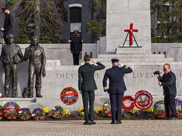 Gunner Ty Shamblin of the 56th Field Regiment and Brantford Fire Chief Todd Binkley salute after laying wreaths on Wednesday morning at the Brant County War Memorial in downtown Brantford.  Brian Thompson/Brantford Expositor/Postmedia Network